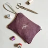 POCHETTE CON MANICO MONOGRAM